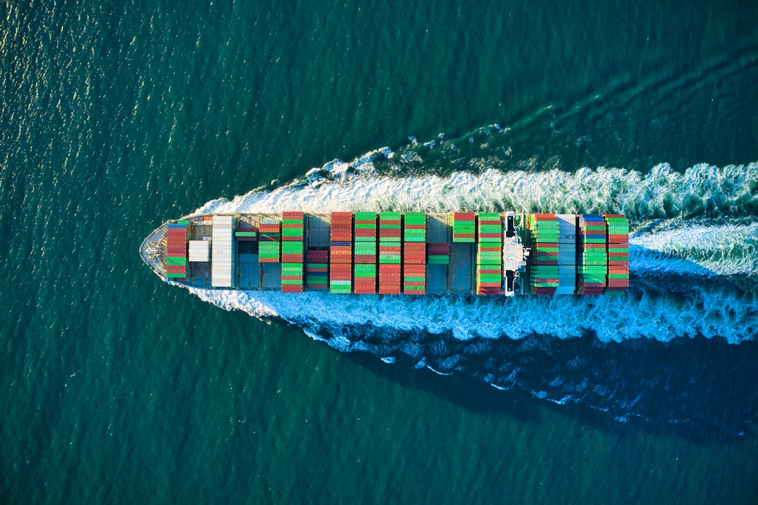 Colorful cargo ship headed out to see aerial